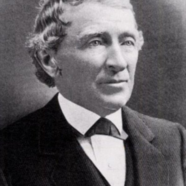 Black and white photograph of an older man, Jesse Fell, wearing a simple suit. He has a nice gaze, looking off into the distance, and a slight upward turn to his mouth