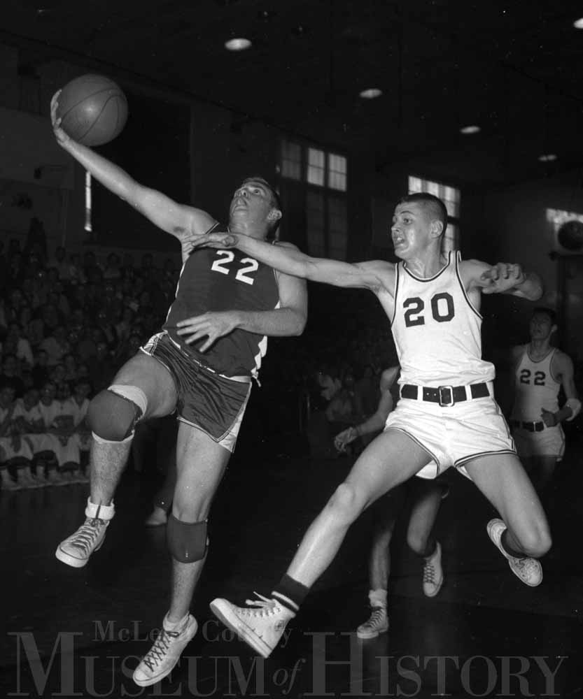 ​Gene Durham (22) of Saybrook-Arrowsmith High attempts a layup during the 1959 county tournament championship game.