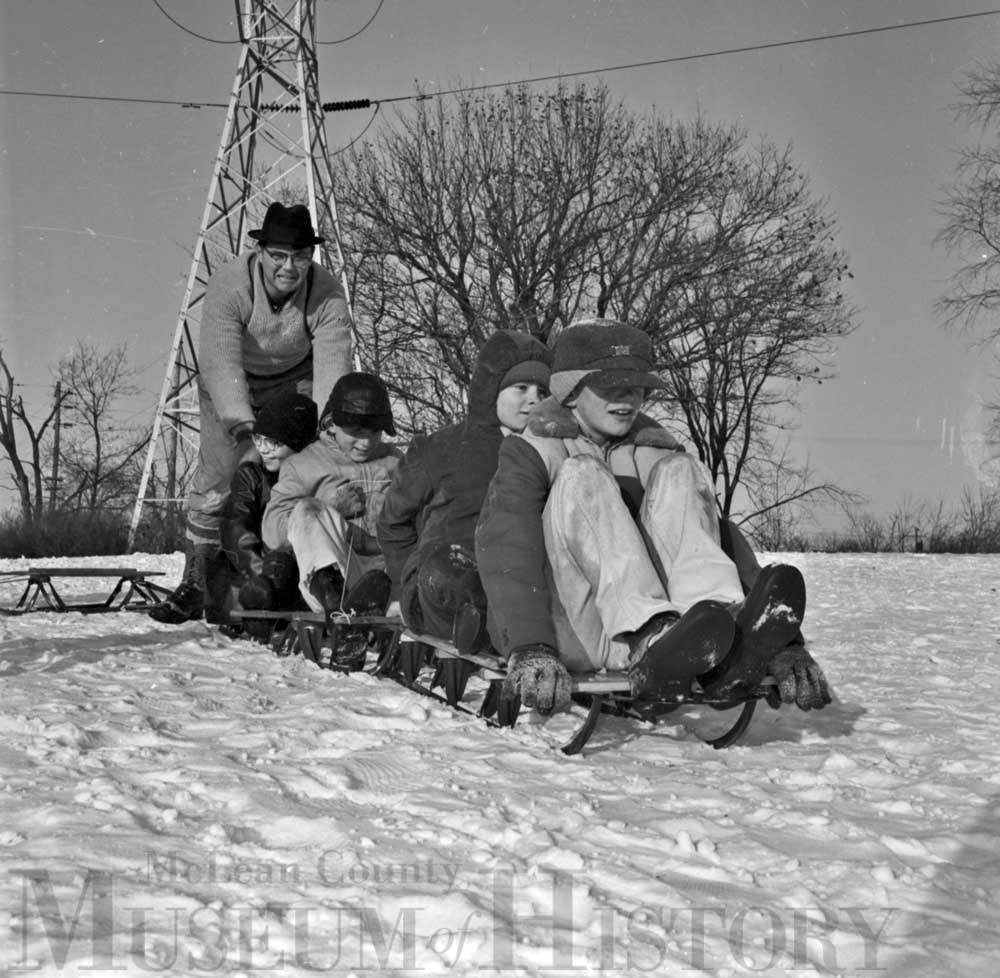 Group of orphans going sledding, 1963