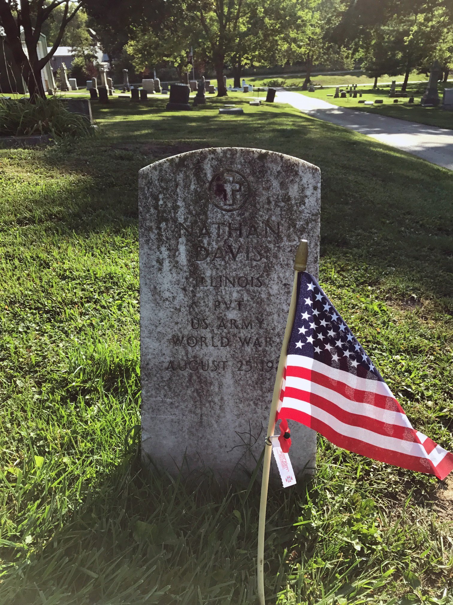 Grave site of Nathan Davis, Pvt Co. M Dev BN No. 2. Grave is marked with a U.S. Flag and poppy at Evergreen Memorial Cemetery, Bloomington, IL.