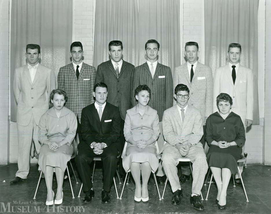 Illinois Soldiers’ and Sailors’ Children’s School.  Dixie Chambers. Jack Cummings, Judy Harvey, Dick Peifer, and Betty Jo Naseef; back row (left to right), Bill Marrs, Leroy Witte, Joe Menton, Don Peterson, Richard Yeager, and Ronald Whitney. Menton was the U-High homecoming king.